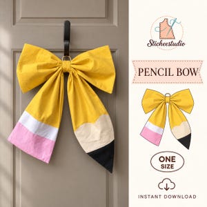May include: A large yellow fabric bow shaped like a pencil, featuring a pink eraser section, a white band, and a black pointed tip. The design includes a gold-tone ring at the center for hanging. Text on the image reads PENCIL BOW and ONE SIZE.