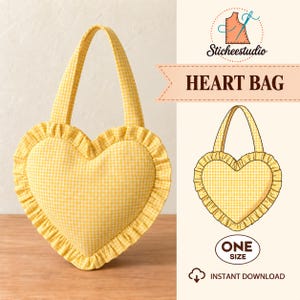 May include: A heart-shaped bag made of yellow and white gingham fabric with a ruffled edge and two top handles. The image includes the text Sticheestudio, HEART BAG, ONE SIZE, and INSTANT DOWNLOAD, along with a technical drawing of the bag.