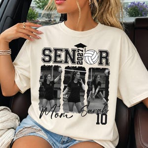 May include: A cream-colored t-shirt featuring the text SENIOR 2027 with a volleyball graphic. Below, three black and white photo panels show a volleyball player in action. The shirt includes the text Mom, Sarah, and the number 10 in black script and block font.