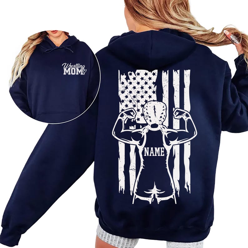 A navy blue hoodie with a white graphic design on the back, depicting a muscular figure with an American flag pattern.