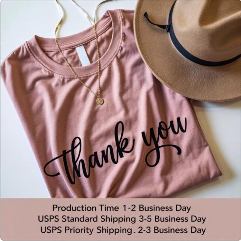 A pink t-shirt with the text "Thank you" printed on it, along with a brown hat and a gold necklace. The image also includes text that says "Production Time 1-2 Business Day USPS Standard Shipping 3-5 Business Day USPS Priority Shipping 2-3 Business Day".