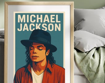 May include: A framed art print featuring a stylized portrait of Michael Jackson. The image shows Jackson wearing a black hat and a red shirt over a white t-shirt. The words "MICHAEL JACKSON" are printed at the top in a bold font.