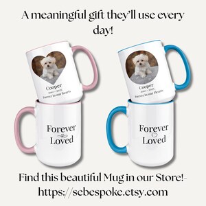 May include: Two white ceramic mugs with colored handles and rims. One mug has a pink handle and rim, the other has a blue handle and rim. Each mug features a photo of a small dog and the text "Cooper 2010-2025 Forever in our Hearts". The bottom mugs say "Forever Loved".
