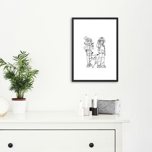 May include: Black framed print featuring a black and white illustration of two cartoon characters and a Pikachu. The artwork is displayed on a white wall above a white dresser. A small potted plant and a clock are on the dresser.