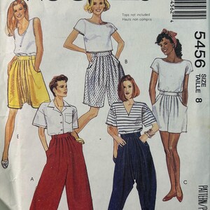 May include: A vintage McCall's sewing pattern with illustrations of women's clothing. The pattern includes designs for shorts, trousers, and tops. The cover is white with the McCall's logo and the number 5456.