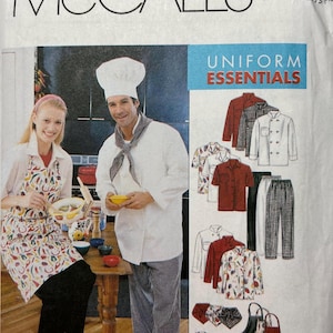 May include: McCall's sewing pattern for Uniform Essentials. The image shows a chef and a woman wearing aprons, along with illustrations of chef coats, shirts, trousers, aprons, and chef hats. The pattern includes various sizes.