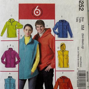 May include: McCall's M5252 sewing pattern envelope featuring illustrations of six fleece jacket and vest designs in lime green, magenta, blue, yellow, orange, and red. The text includes "McCall's", "M5252", "Size XM", and "All with MP3 player pocket".