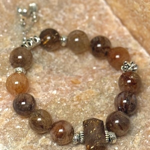 Black Golden Super Seven Crystal Bracelet – Natural Rutilated Quartz Energy Stone | Handmade Spiritual Jewelry for Protection & Focus