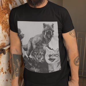 T-Rex and Cat Selfie Funny Unisex Softstyle T-Shirt, Dinosaur Lover Gift, Cat Owner Tee, Humorous Graphic Shirt, Jurassic Park Fan Top