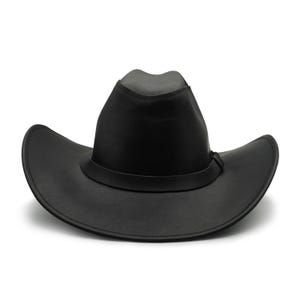 May include: A solid black leather cowboy hat featuring a pinched crown and a wide, curved brim. The hat includes a matching black leather band encircling the base of the crown, with visible stitching along the edges of the brim and the band.