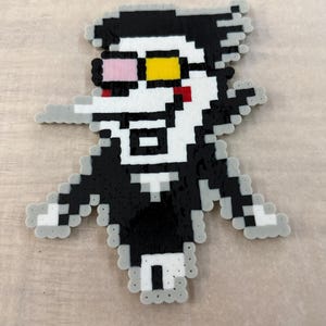 Figura de cuentas derretidas de Spamton