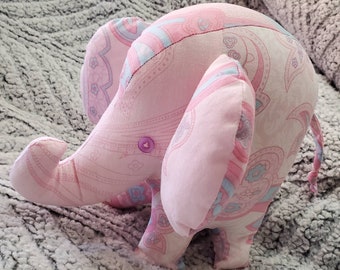 Cute, cuddly, pink plush elephant snuggle toy/animal made of 100% cotton fabric. Animal/Elephant themed nursery.