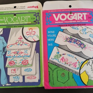May include: Two packages of iron-on transfer patterns for embroidery or paint. The package on the left features cheerful new florals and the package on the right features a variety of designs including swans, flowers, and hearts. Both packages feature the brand name "Vogart" and the words "Repeat Transfer Patterns".