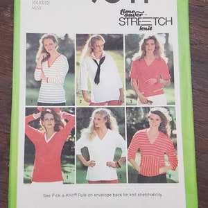 May include: Simplicity sewing pattern number 9044 for stretch knit tops. The pattern includes five different styles of tops with short or long sleeves, a V-neck, and a variety of colors and patterns. The pattern is for sizes 6, 8, 10, 12, 14, and 16.