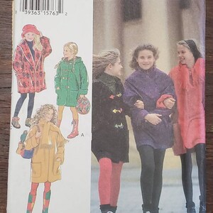 May include: A sewing pattern for four different styles of children's coats. The pattern includes a red and white patterned coat, a green coat with a toggle closure, a purple coat with a hood, and a red coat with a hood. The pattern is for sizes 7-12.