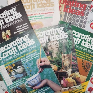 May include: A collection of vintage "Decorating Craft Ideas" magazines for the creative woman. The magazines feature a variety of craft projects, including hand-painted china, embroidery, and needlework.