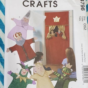 May include: A sewing pattern for making five hand puppets: a king, a queen, a jester, a frog, and a princess. The pattern is from McCall's Crafts and is numbered M4796.