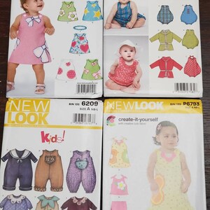 May include: Four sewing pattern packages for children's clothing. The patterns are from New Look and feature a variety of styles, including dresses, rompers, and jumpsuits. The patterns are for sizes newborn to large.