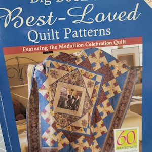 May include: A book titled "Big Book of Best-Loved Quilt Patterns" featuring the Medallion Celebration Quilt. The cover shows a quilt with a 60th anniversary theme and a photo of a family in the center.