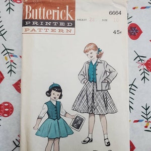 May include: A vintage sewing pattern for a girl's dress. The pattern is for a dress with a skirt and a vest. The pattern is from Butterick and is number 6664. The pattern is for a size 10 and a 28 inch bust. The pattern is printed on white paper with black and red text. The pattern is for a dress with a skirt and a vest. The pattern is from Butterick and is number 6664. The pattern is for a size 10 and a 28 inch bust. The pattern is printed on white paper with black and red text.