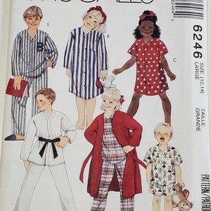 May include: A sewing pattern for children's pajamas. The pattern includes five different styles: a striped shirt, a star-print shirt, a plaid robe, a karate uniform, and a shirt with a cartoon print. The pattern is for sizes 12-14.