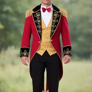 May include: A red tailcoat with black velvet trim, gold embroidery, and gold epaulets. The coat is paired with a gold vest, black trousers, a white shirt, and a red bow tie. The outfit is formal wear.