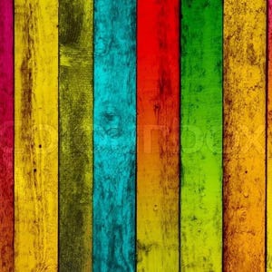 May include: A colourful background of vertical wooden planks, each painted a different shade. The planks display a variety of colours, including pink, yellow, green, blue, red, and orange, creating a textured and visually appealing surface.