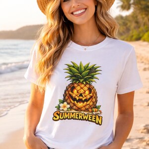 May include: White t-shirt with a jack-o'-lantern pineapple design. The pineapple has green leaves and a carved face. The shirt features the word "SUMMERWEEN" in yellow and orange. A tropical flower is on the left side of the pineapple.