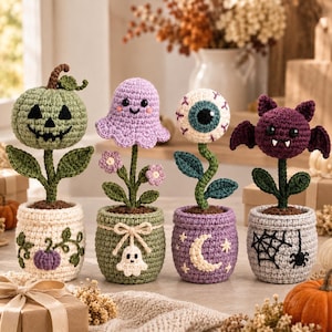 May include: Four crocheted potted plants featuring Halloween themes: a green jack-o'-lantern, a lavender ghost, a white eyeball, and a purple bat. Each plant has green stems and leaves, sitting in uniquely decorated crocheted pots with yarn details.