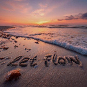 May include: A beach scene at sunset with the words "Let Flow" written in the sand. The sky is a mix of orange, pink, and purple hues, reflecting on the wet sand and the ocean waves. A serene and inspirational image.