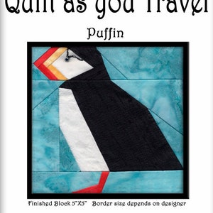 May include: A quilt block featuring a stylized puffin with a black body, white chest, orange beak, and red feet. The puffin is set against a blue background. The block is 5 inches by 5 inches. "Quilt as you Travel" and "Puffin" are written in black text above the block. "Finished Block 5"x5" Border size depends on designer" is written in black text below the block.
