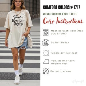 May include: A cream-colored short-sleeve t-shirt with the black text Your Design Here printed on the front. The image includes a care instructions chart for Comfort Colors 1717, specifying machine wash cold at 30C or 90F, no bleach, tumble dry low, iron medium heat, and no dry cleaning.
