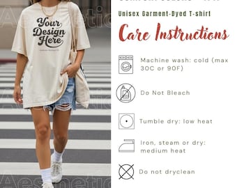 May include: A cream-colored short-sleeve t-shirt with the black text Your Design Here printed on the front. The image includes a care instructions chart for Comfort Colors 1717, specifying machine wash cold at 30C or 90F, no bleach, tumble dry low, iron medium heat, and no dry cleaning.