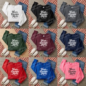 Könnte beinhalten: Eine Auswahl an Sweatshirts in verschiedenen Farben, darunter Weiß, Schwarz, Grau, Grün, Burgunderrot, Marineblau, Rot, Blau und Pink. Jedes Sweatshirt trägt den Text "Your Design Here" und wird mit Jeans und weißen Turnschuhen kombiniert.