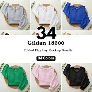 May include: A mockup bundle of Gildan 18000 sweatshirts in various colors, including gray, white, blue, green, pink, and black. The image displays the sweatshirts folded on woven mats, with the text "34 Colors" and "Gildan 18000" visible.