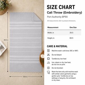 May include: A light gray Cali throw with white stripes and fringe. The throw measures 39.5 inches wide and 69.5 inches high. The care instructions include machine wash cold, tumble dry low, and do not bleach.