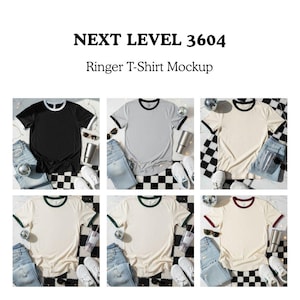 May include: A mockup of six Next Level 3604 ringer t-shirts in various colours. The shirts are black, grey, and cream, each with contrasting neck and sleeve bands. Accessories include jeans, sunglasses, trainers, and tumblers, arranged on a black and white checkered surface.