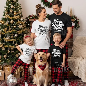May include: A family of five, including a dog, poses in front of a Christmas tree. They wear matching black and white t-shirts with the text "Your Design Here" and red and black plaid pajama pants. The dog wears a matching bandana.