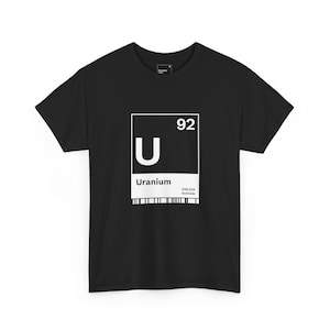 May include: Black t-shirt with a white graphic of the periodic table element Uranium. The graphic includes the element symbol "U", atomic number "92", and the word "Uranium".