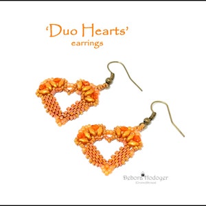 May include: A pair of handmade earrings in a heart shape, crafted with orange and peach-colored beads. The earrings have a vintage bronze hook and the text "'Duo Hearts' earrings" in orange.