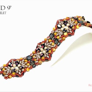 May include: A beaded bracelet with the text "CLOUD 9" and "BRACELET". The bracelet features a pattern of various beads in shades of red, gold, black, and silver. The bracelet is displayed on a white surface.