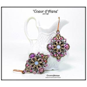 May include: Handmade beaded earrings in a floral design. The earrings feature a combination of pink, purple, and gold beads, with a central iridescent bead. The text "Coeur d'Alene" and "Crownofstones" are visible.