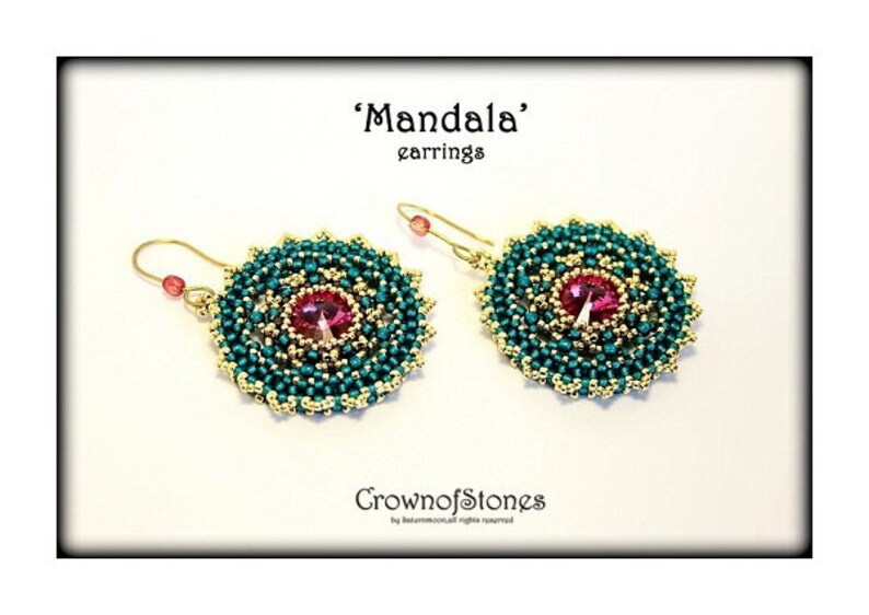 May include: A pair of 'Mandala' earrings. Each earring features a central pink gemstone surrounded by teal and gold beads, creating a circular design. The earrings have gold-colored ear wires and small pink beads.