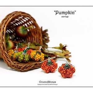 May include: Orange and yellow beaded pumpkin earrings with silver-tone accents. The earrings are displayed with other pumpkin earrings and apples spilling from a woven basket. The text reads "Pumpkin" earrings.