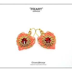 May include: A pair of heart-shaped earrings. The earrings are coral-colored, beaded, and feature a central red gem surrounded by gold beads. The text "'HEART' EARRINGS" is at the top. The brand name "Crownofstones" is at the bottom.