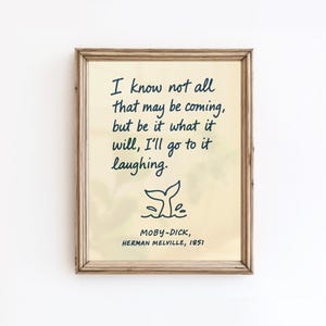 May include: Framed print with a quote from Moby-Dick by Herman Melville. The text, in a handwritten style, reads "I know not all that may be coming, but be it what it will, I'll go to it laughing." A whale tail illustration is below the quote.