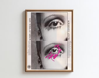 May include: Framed poster with a black and white image of two eyes, with a splash of pink paint on the lower eye. The poster includes text that reads "School of Visual Arts" and "Faculty Exhibition."