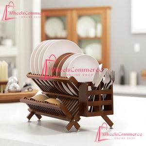 May include: A wooden dish rack with two tiers, holding white and brown plates, along with silverware. The rack is made of dark brown wood and has a slatted design for drying dishes. The rack is on a white surface.