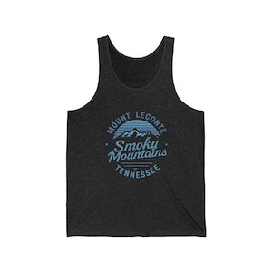 May include: Dark grey vest top featuring a blue and white graphic. The graphic reads "Mount LeConte Smoky Mountains Tennessee" in a circular design with a mountain range illustration.
