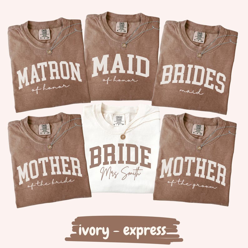Coordinated bridal party shirts featuring varsity-style lettering for bride, maid of honor, matron of honor, bridesmaids, and mothers, printed on soft comfort colors tees for wedding day moments.